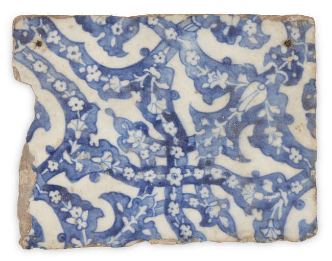 
	
		A blue and white pottery tile in the Iznik style, late 19th-early 20th century, of...