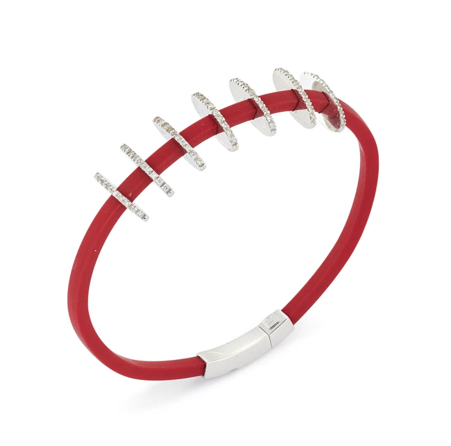 A rubber bangle, designed as a square section rubber bangle with seven applied diamond-set line...