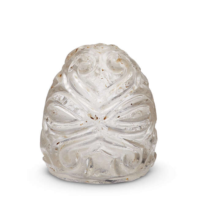 
	
		An Abbasid or Fatimid carved rock crystal chess piece, 9th-11th century, carved with deep...