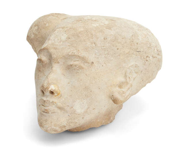 
	
		A sizeable Egyptian style limestone head of an Amarna style princess, with elongated...