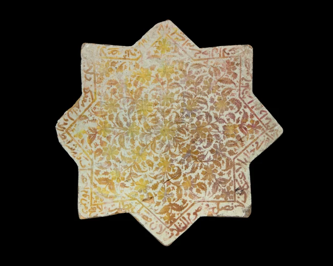 A lustre star pottery tile, Kashan, Central Iran, 12th/13th century, 
With dense and radiating...