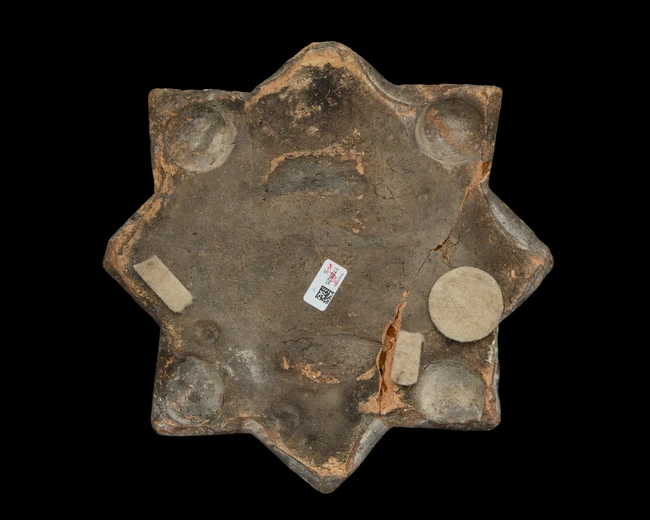 A lustre star pottery tile, Kashan, Central Iran, 12th/13th century, 
With dense and radiating...