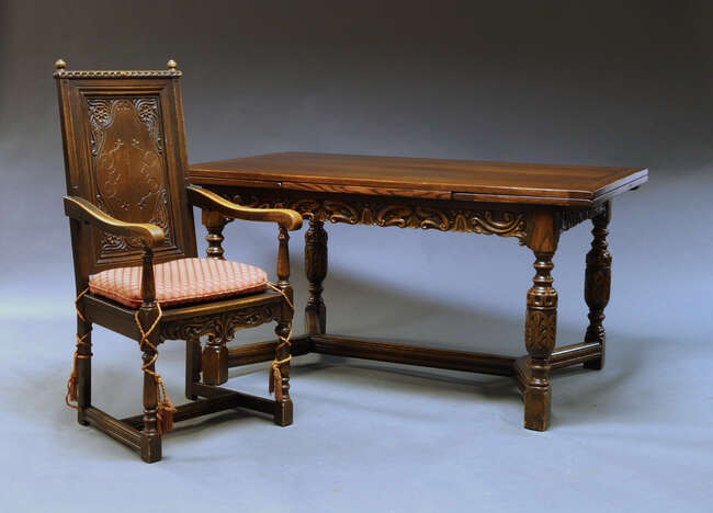 
	
		A Jacobean style oak draw leaf dining table, early 20th Century, the rectangular top with...