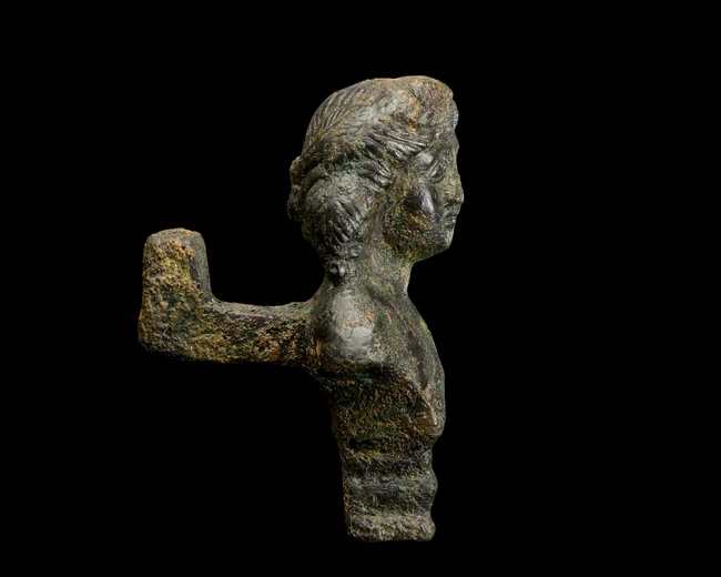 A Roman bronze stool support with the bust of a youth, Circa 2nd-3rd Century A.D.,
On a stepped...