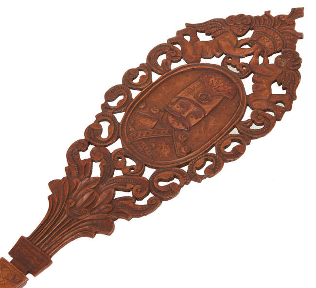 
	
		An inscribed pear-wood sherbert spoon (qashaq) with portrait of Nasir Al-Din Shah,...