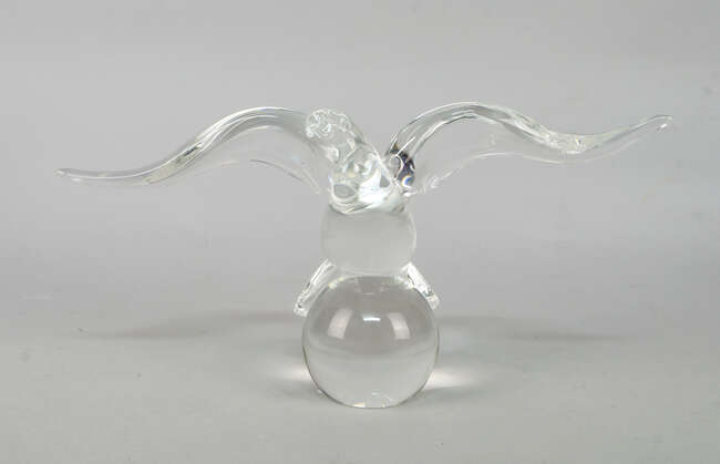 
	
		 James Houston for Steuben, a glass model of an eagle perching on a ball, designed 1964,...