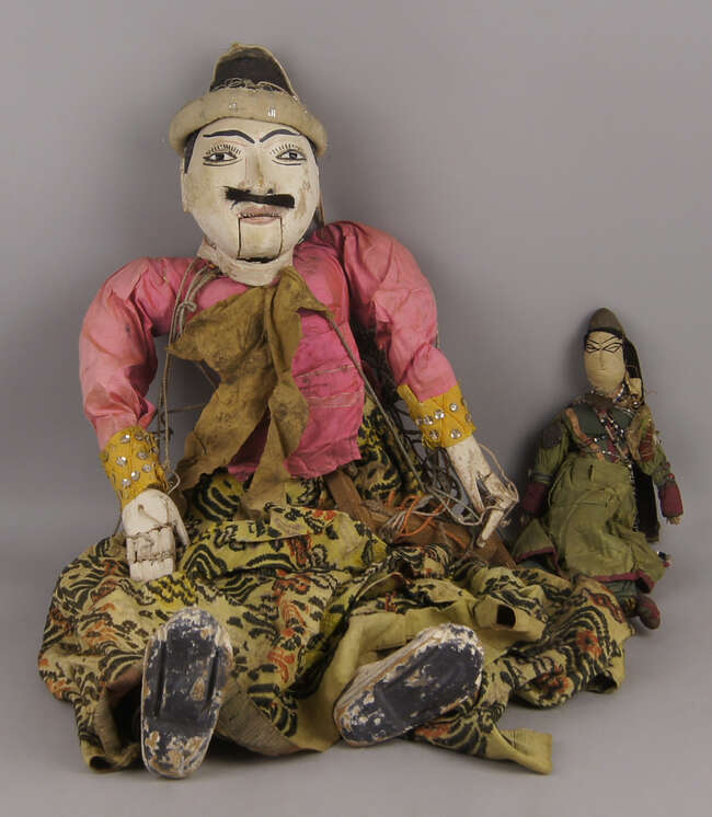 
	
		A marionette puppet of an Indonesian man, 19th/20th century, 77cm high, together with a...