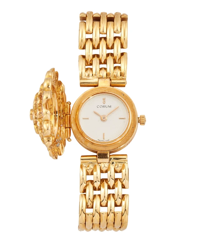 Corum. An 18ct gold diamond set quartz watch with custom cover and braceletReference 24.212.65,...