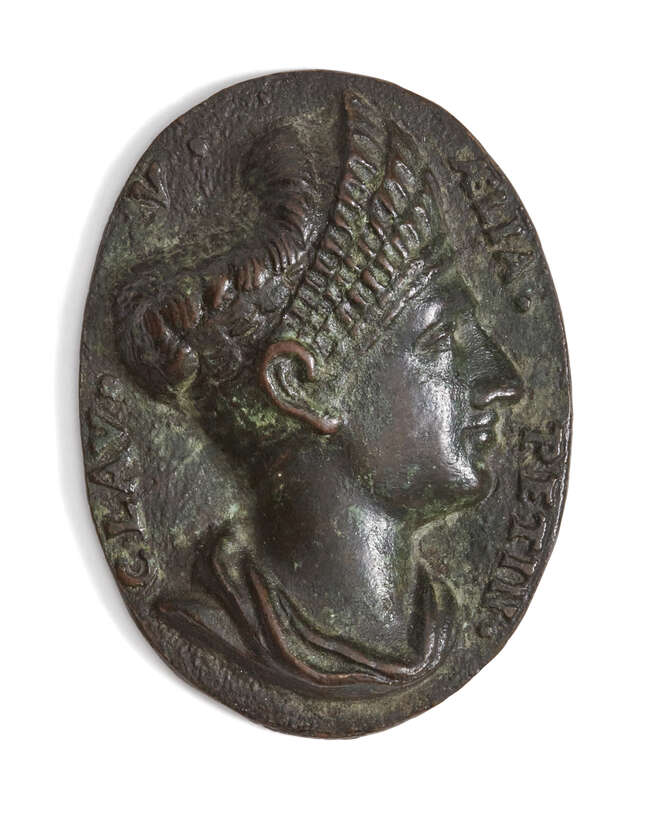 
	
		A bronze oval medallion After The Antique
		With the bust of a Roman lady of high birth,...