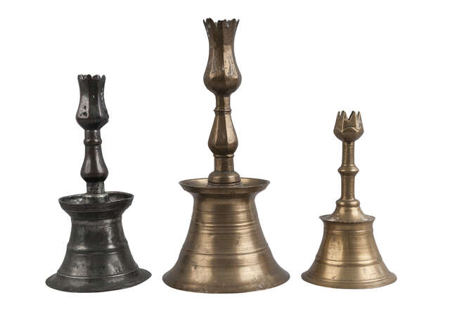 
	
		Three Ottoman candlesticks, Turkey, 16th/17th century, of typical form, two brass, one of...