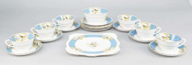 
	
		A Tuscan bone china tea service, late 19th/early 20th century, decorated with reserves of...