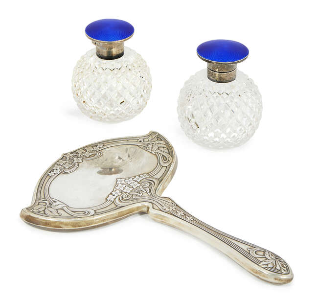 
	
		An American Sterling silver Art Nouveau hand mirror, c.1900. Theodore W. Foster & Bro. 