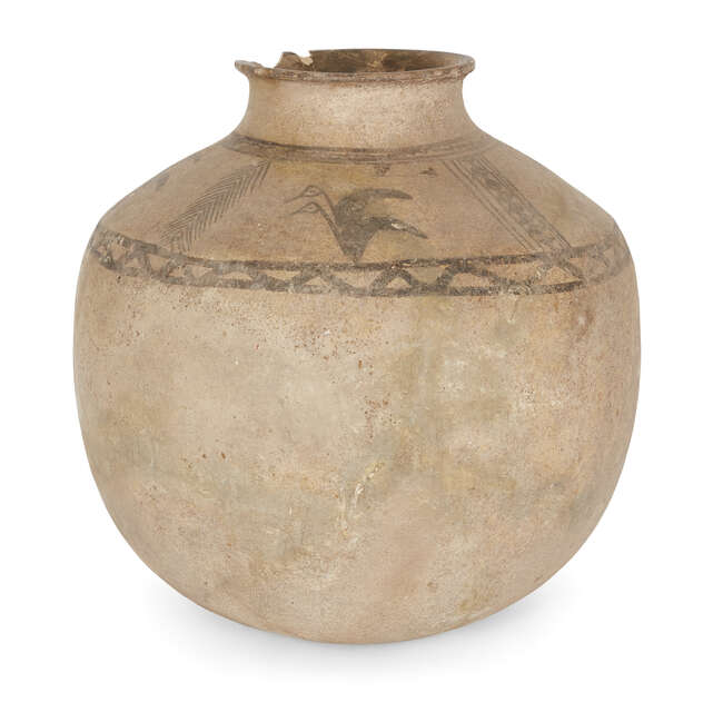 A buff pottery vessel, the sloping shoulders decorated in added umber with four pairs of aquatic...