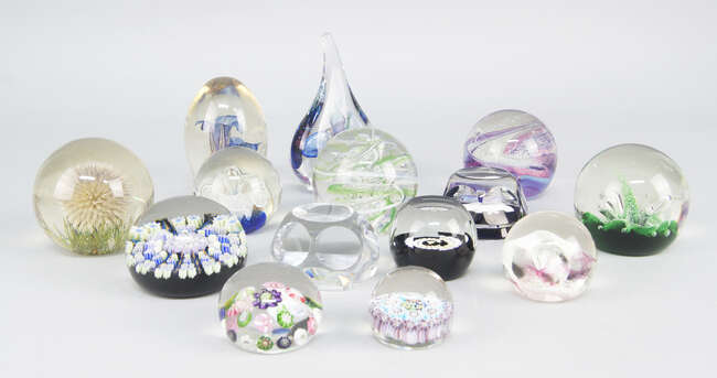 
	
		A Baccarat glass paper weight, inset to the interior with a figure of Taurus the bull,...