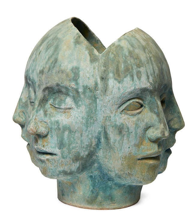
	
		Glenys Barton,
		British b. 1944-
		
		Multifaced Head I, 1990;
		 
		stoneware with...
