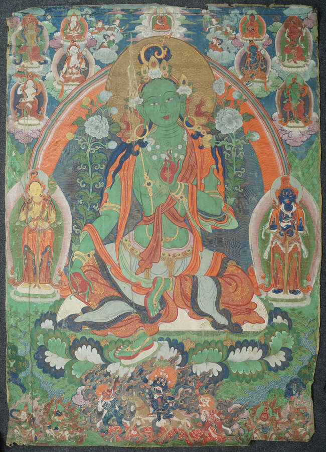 
	
		A large Tibetan thangka of Green Tara, 19th century, distemper on cloth, Tara seated in 