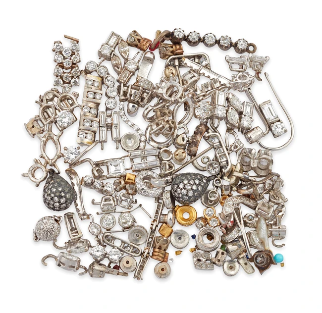 A group of diamond set components, including: a pavé single-cut diamond egg shaped drop; a...