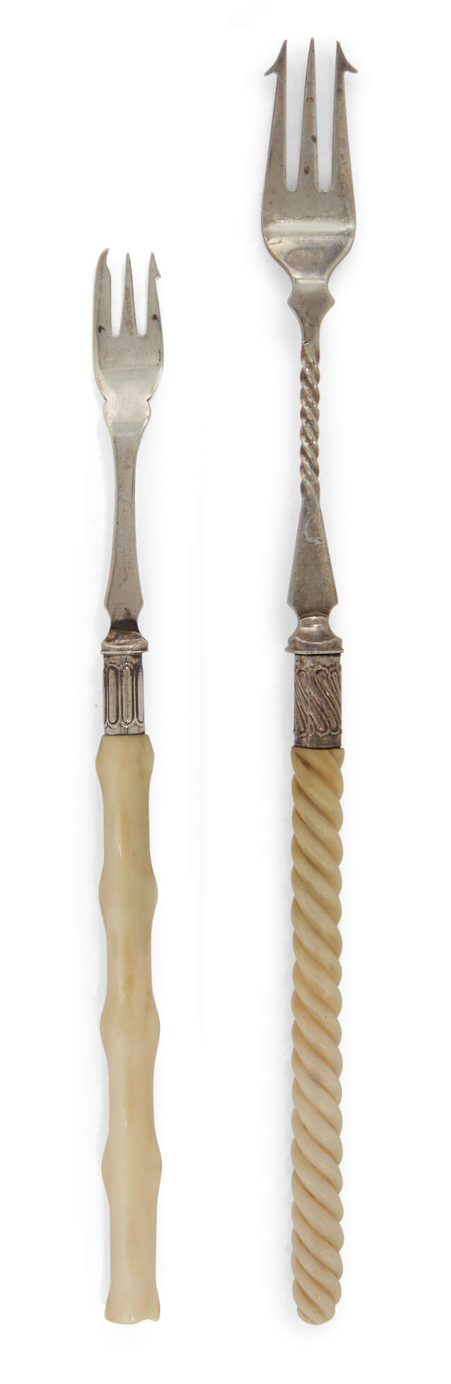 
	
		Two Victorian silver pickle forks with ivory handles, one Sheffield, c.1855, JRB, with...