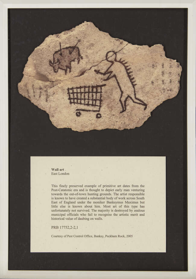 Banksy, British b.1974- Peckham Rock; wooden postcard, 12 x 18 cm, (framed) (ARR)