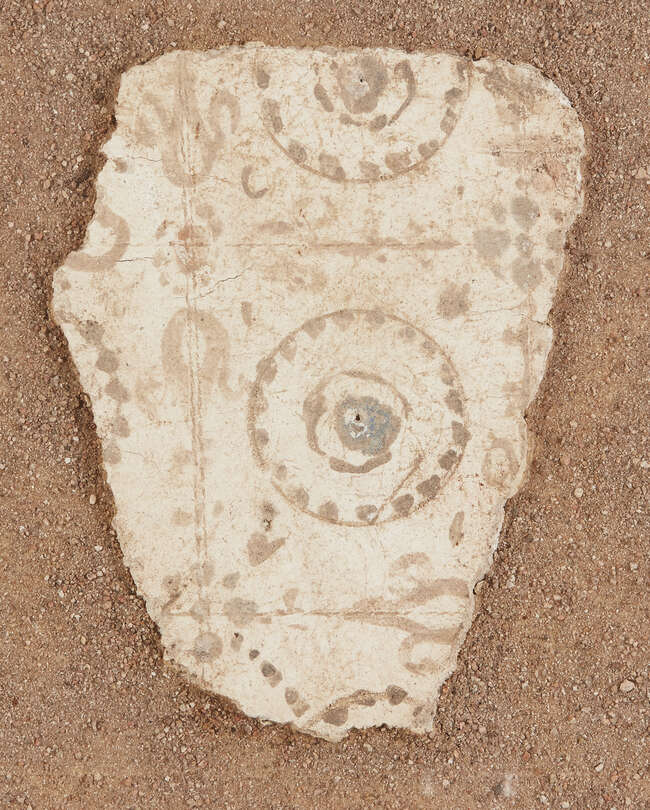 
	
		A Roman fresco fragment 
		Circa 1st Century A.D.
		The ochre decoration on a cream...