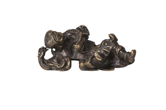 
	
		A Chinese bronze scroll weight, Ming dynasty, 17th century, modelled as Liu Hai...