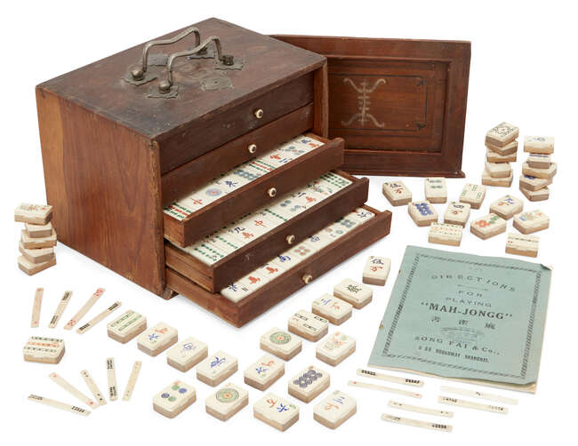 
	
		A Chinese boxed bamboo backed and ivory Mahjong set, early 20th century, with instruction...