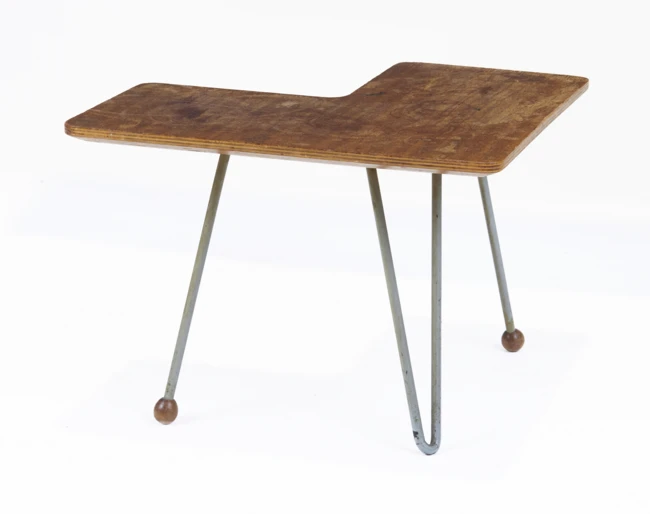 Scandinavian Occasional table, circa 1950s Teak plywood, lacquered metal 28.5cm high, 56cm...