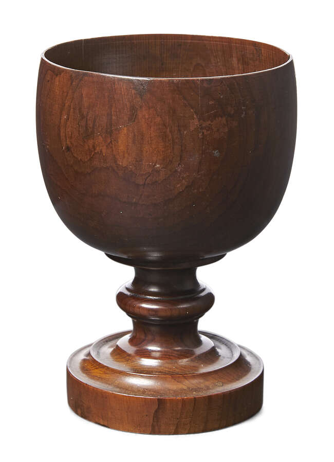 
	
		An English cedar goblet, late 18th century, the bowl raised on waisted stem and circular...