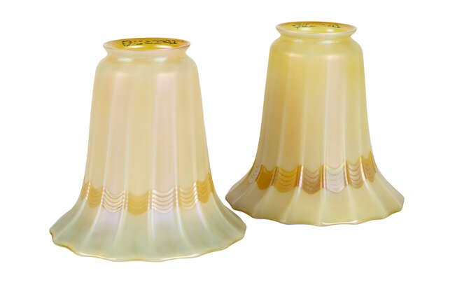 
	
		Quezal, a pair of American iridescent glass bell shaped shades
		c.1910, signed on the...