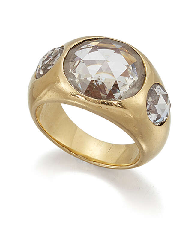 
	
		A rose cut diamond three stone gypsy ring, the central circular rose-cut diamond within a...