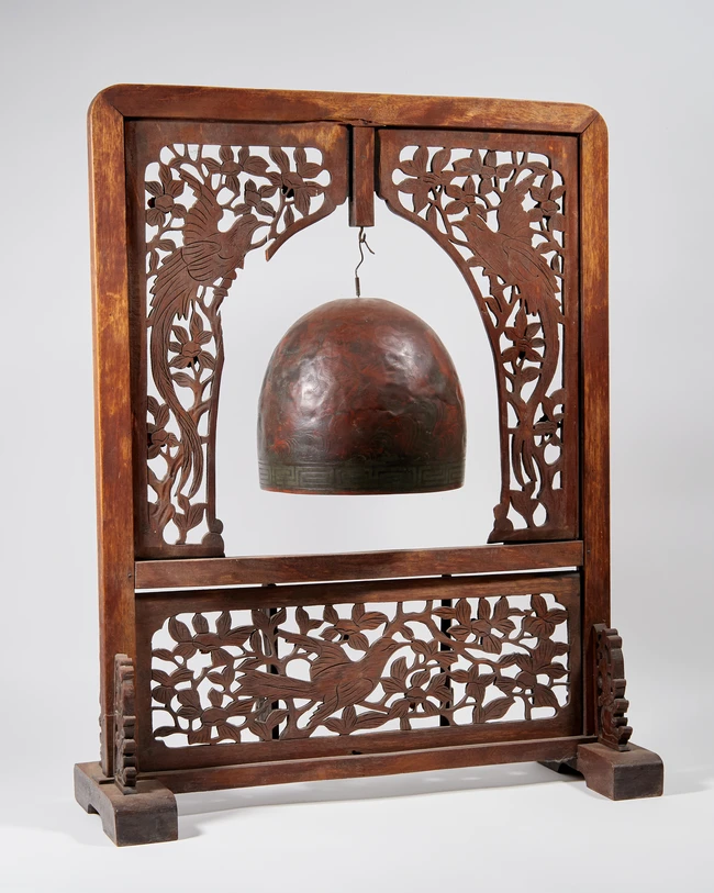 A Chinese hardwood gong, 20th century, the rectangular frame with carved and pierced decoration,...