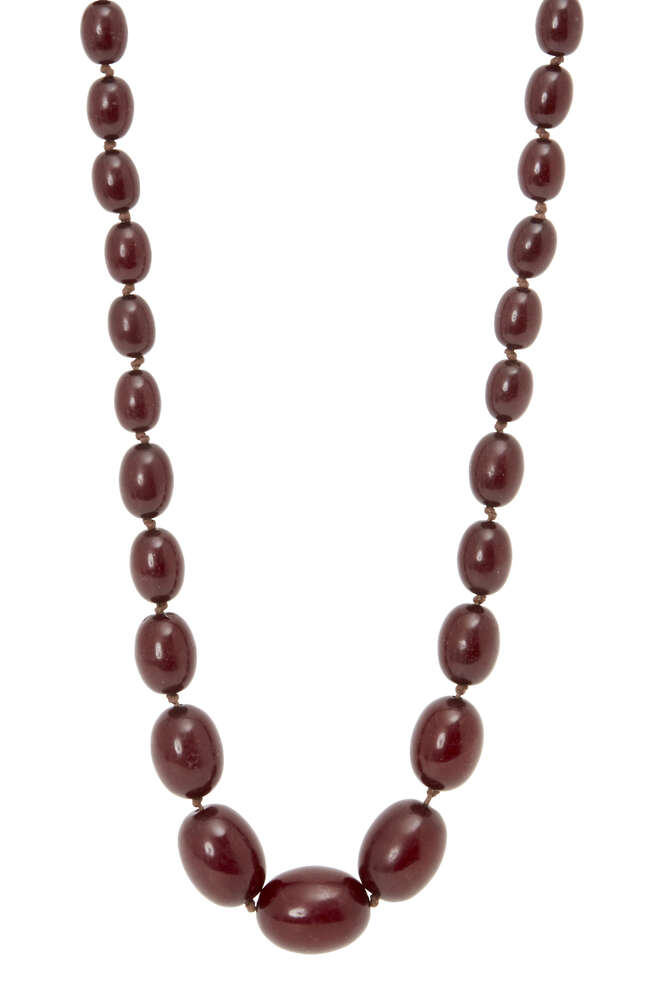 
	
		A cherry amber graduated bead necklace, late 19th century, consisting of forty-three oval...