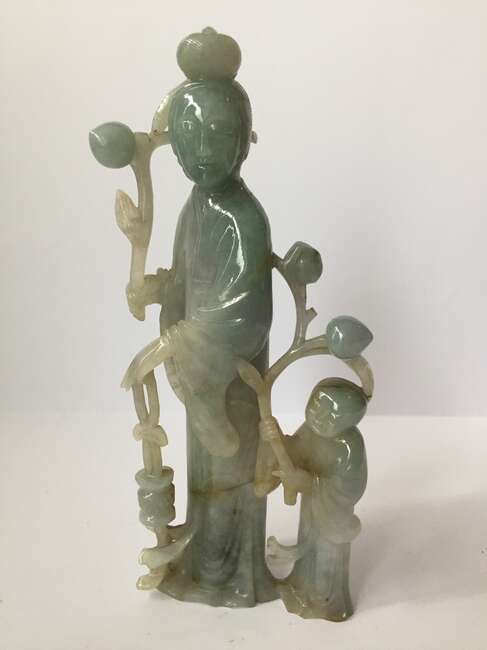 
	
		A Chinese jadeite figure of a woman and child, early 20th century, carved standing, each...