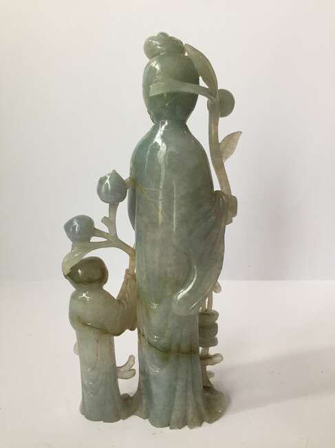 
	
		A Chinese jadeite figure of a woman and child, early 20th century, carved standing, each...