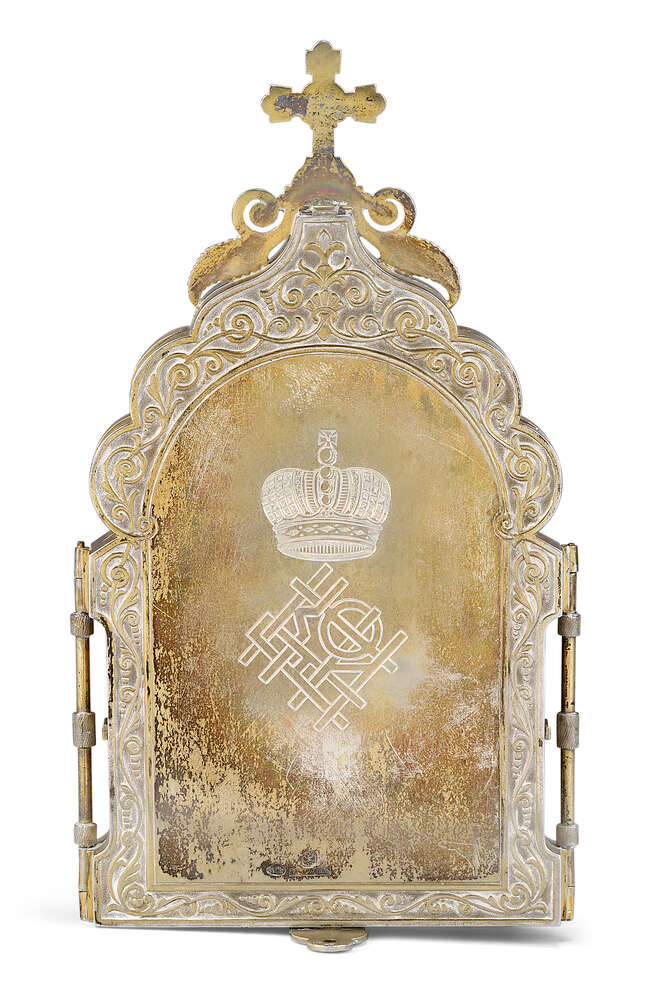A Russian silver-gilt travelling triptych icon, by Ivan Khlebnikov, Moscow, 1899-1908, assay...
