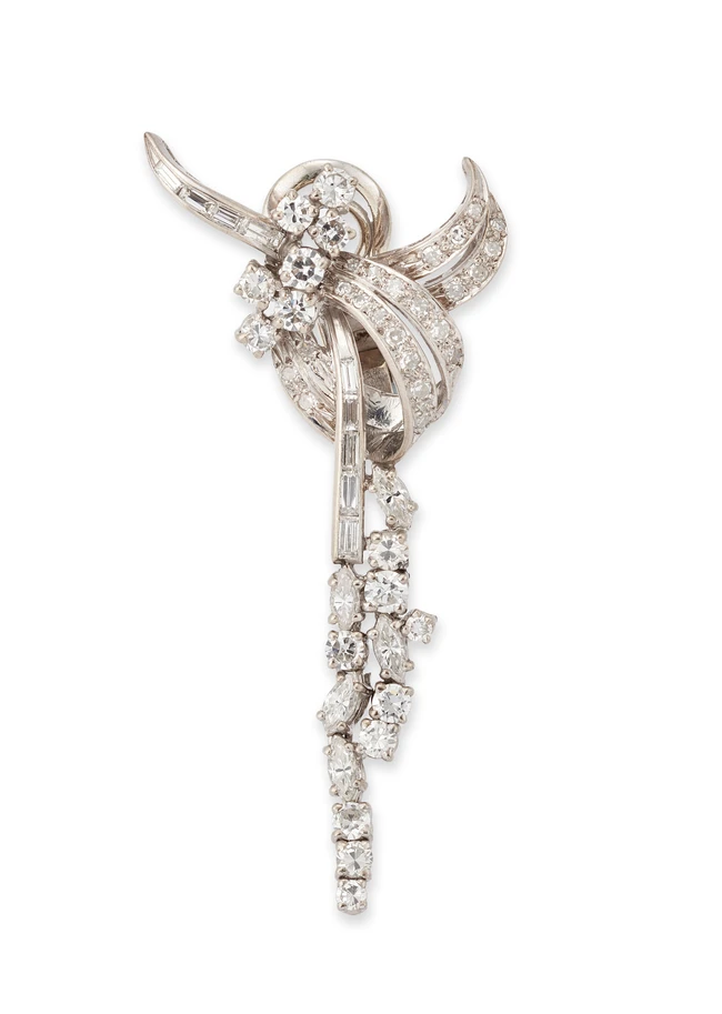 A single diamond set ear clip, designed as a brilliant-cut, single-cut and baguette-cut diamond...