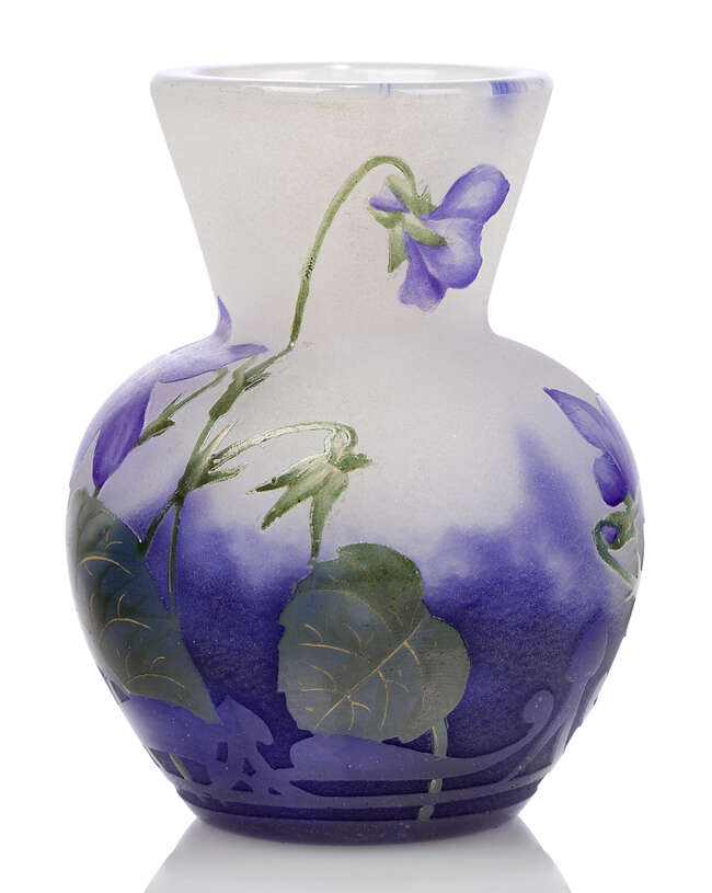 
	
		Daum, a miniature vase enamelled with violets 
		c.1910, signed in relief Daum Nancy...