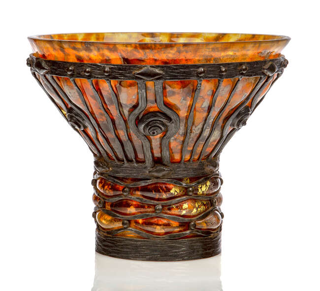 
	
		Daum and Louis Majorelle (1859-1926), an Art Deco cased glass vase blown into a metal...