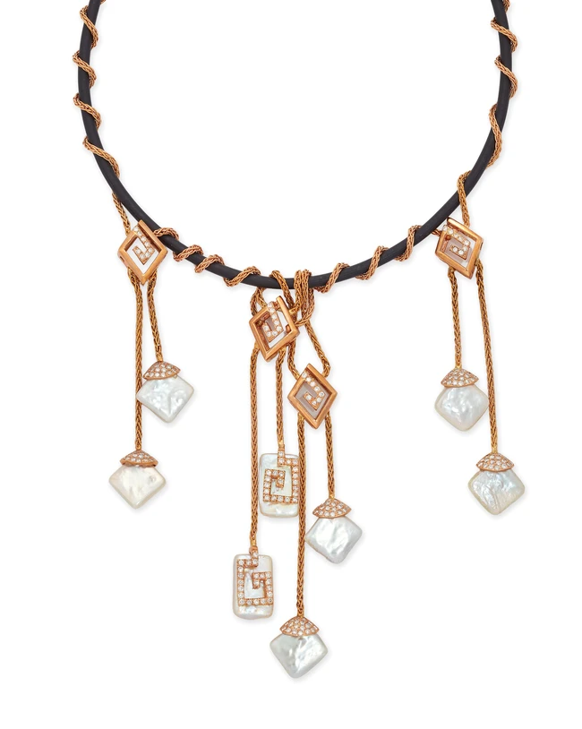A freshwater cultured pearl and diamond necklace, designed as a rubber cord with wrapped...