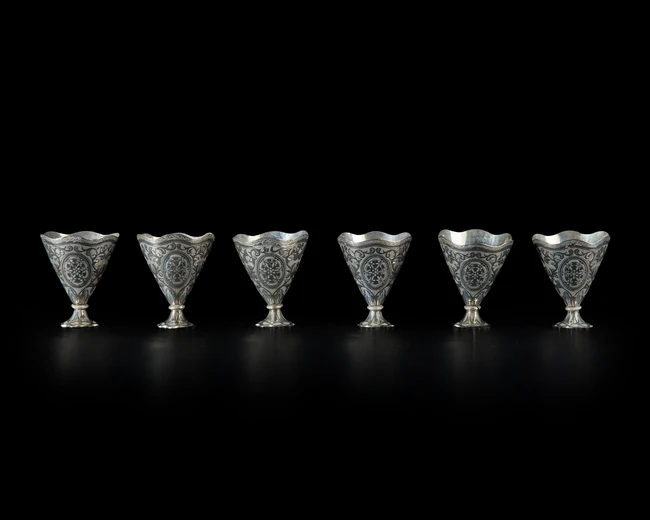 Six nielloed white metal cup holders (zarfs), Ottoman Turkey or Provinces, or possibly Russia...