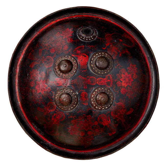 
	
		A lacquered rhino hide shield with figurative decoration, Rajasthan, India, late 18th...