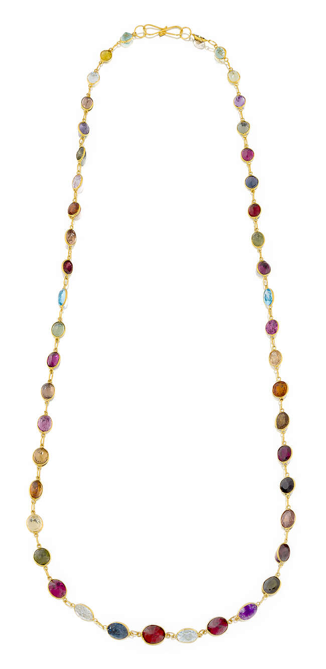 
	
		A multi-gem necklace, composed of a line of oval and circular gems, gems include...