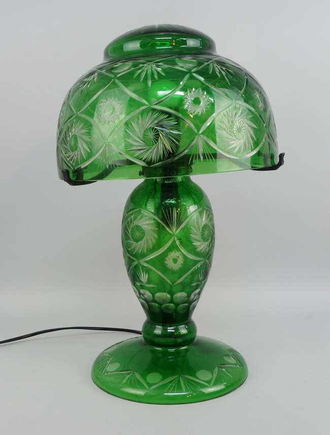
	
		A Victorian green and clear overlay glass lamp, converted to electricity, the domed shade...