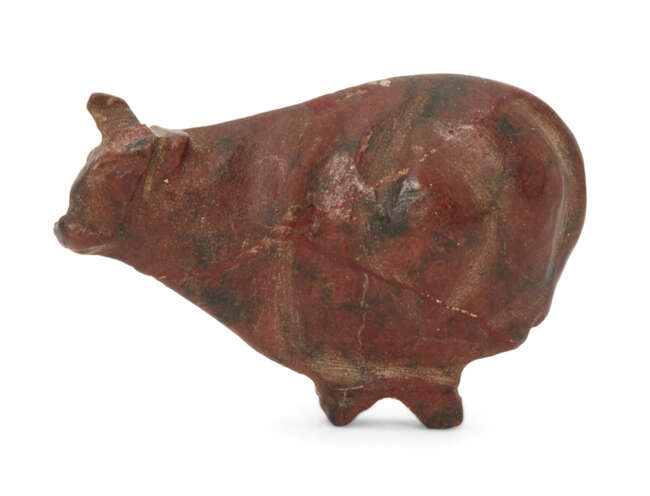 
	
		An Egyptian New Kingdom red jasper trussed ox amulet, 18th  20th Dynasty, circa 1550 ...