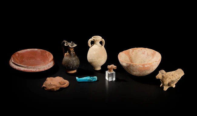 A collection of pottery vessels and objects, including a Cypriot Bronze Age hemispherical bowl,...