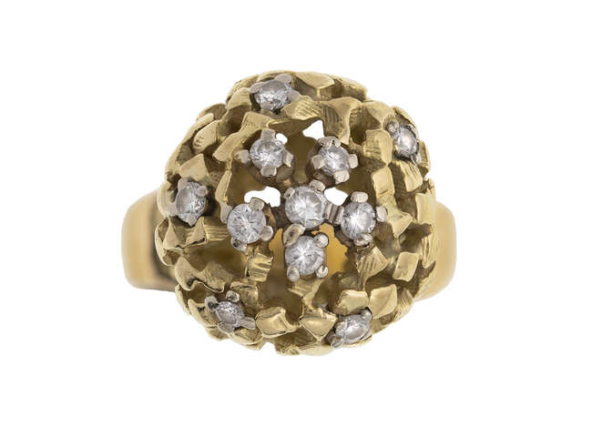 
	
		A diamond ring, by John Donald, designed as an open work textured sphere accented with...