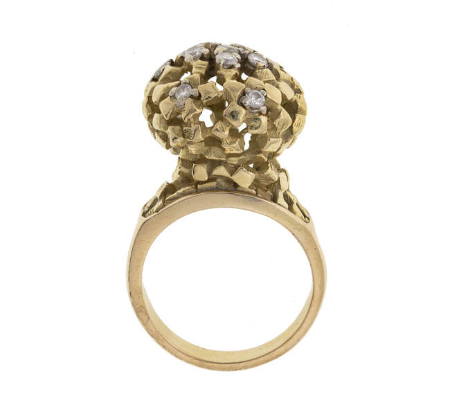 
	
		A diamond ring, by John Donald, designed as an open work textured sphere accented with...