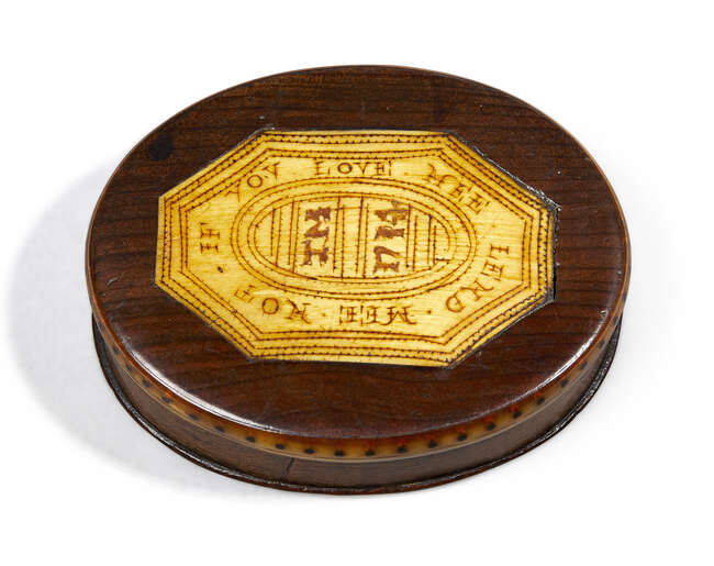 
	
		An English horn mounted treen snuff box, dated 1714, the cover inscribed IF YOU LOVE ME...