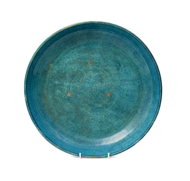 
	
		A large Chinese stoneware monochrome dish, 17th/18th century, with allover turquoise...