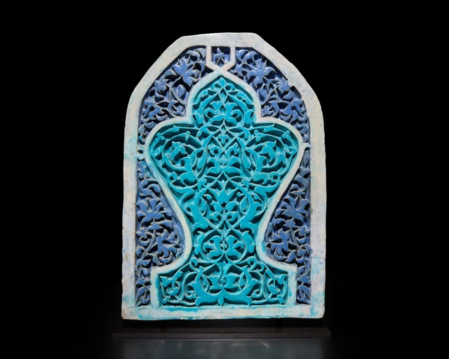 A large turquoise and cobalt blue glazed carved pottery tile or panel,  Timurid western...